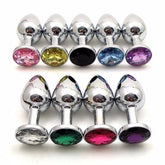 Round stainless steel anal plug with jewel detail in red for added visual appeal